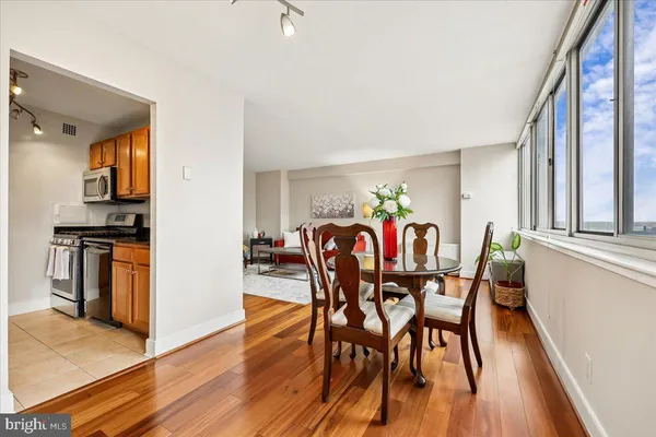 a view of a dining room with furniture and wooden floor
