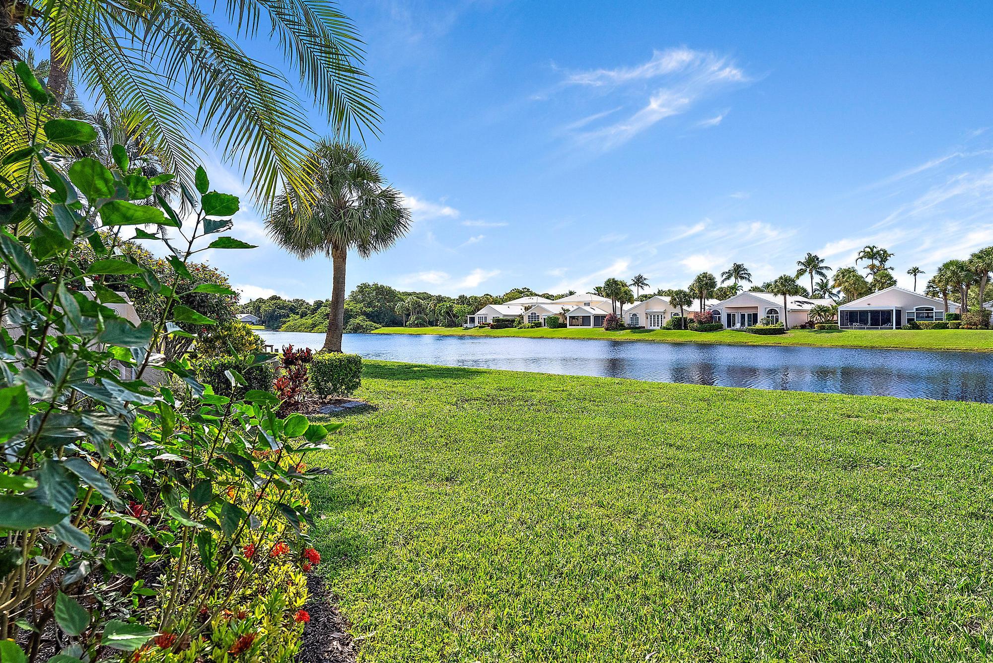 3733 Cape Pointe Circle Jupiter, FL 33477 - Photo 12 of 38 a view of a garden with houses