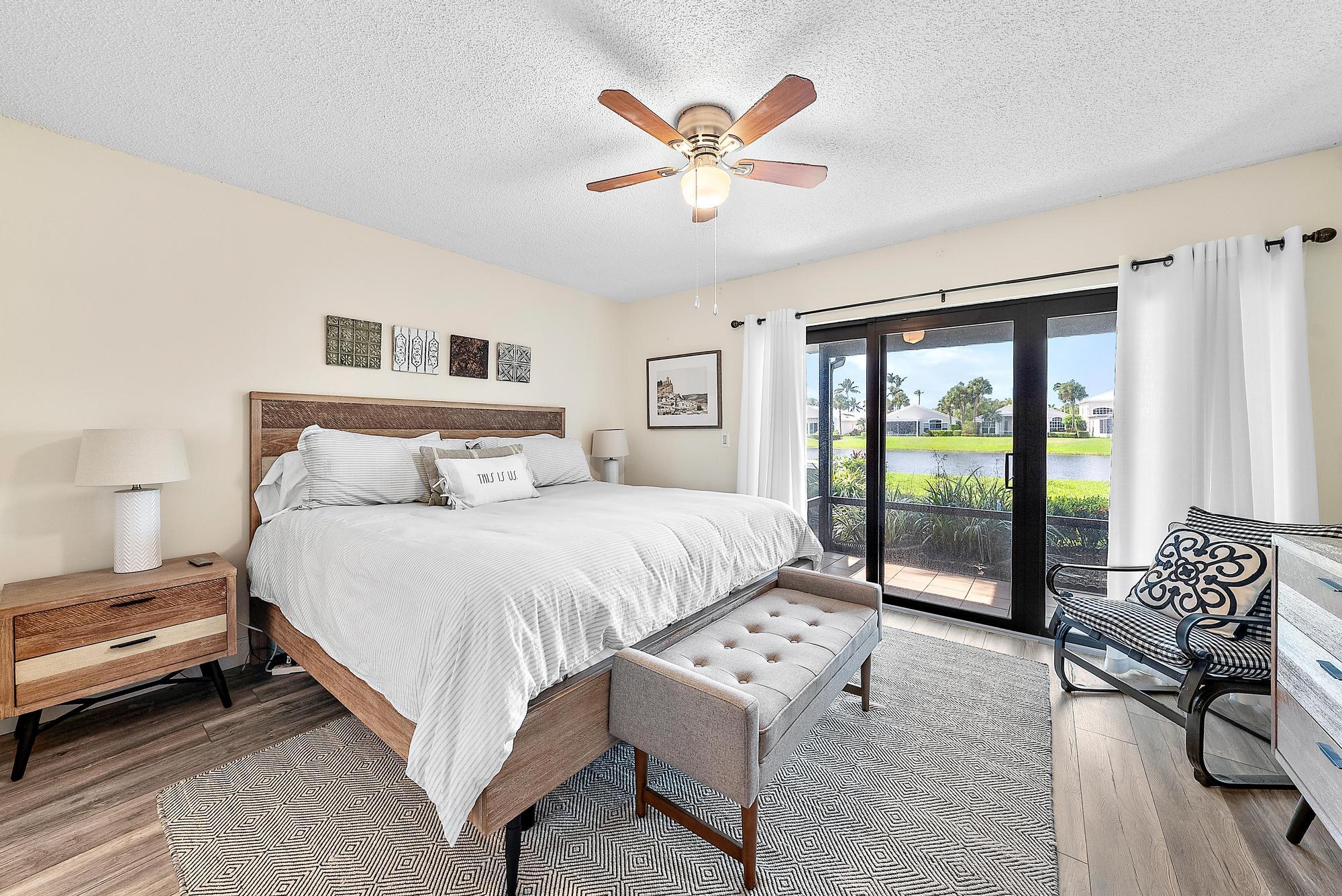 3733 Cape Pointe Circle Jupiter, FL 33477 - Photo 13 of 38 a bedroom with a large bed and a window