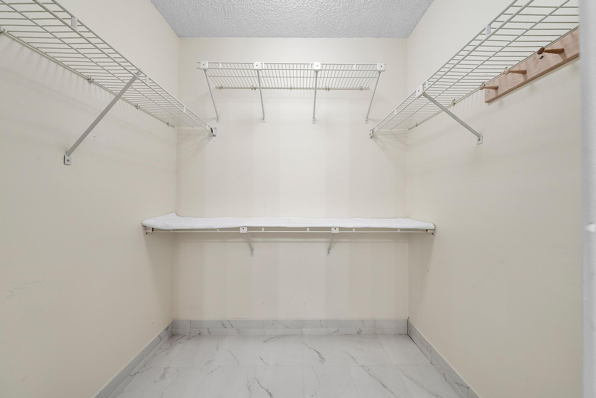 3733 Cape Pointe Circle Jupiter, FL 33477 - Photo 15 of 38 a view of a room with racks on the wall