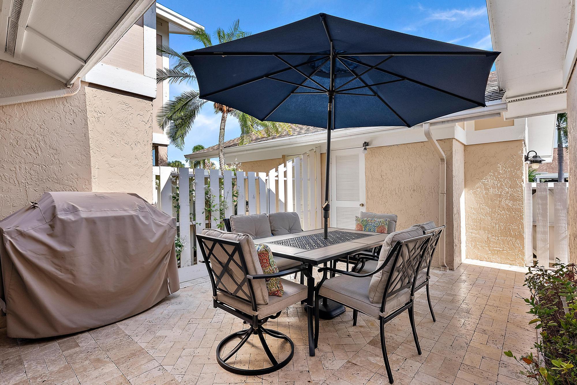 3733 Cape Pointe Circle Jupiter, FL 33477 - Photo 21 of 38 a view of an outdoor space with porch and furniture