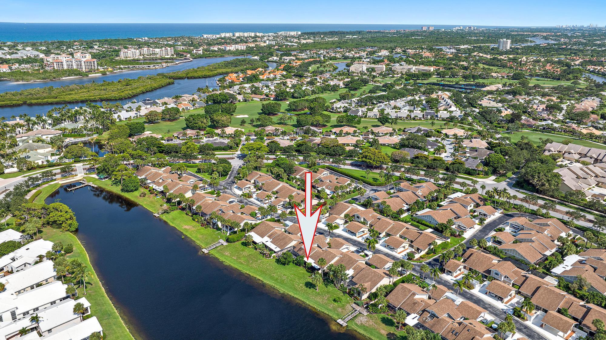 3733 Cape Pointe Circle Jupiter, FL 33477 - Photo 29 of 38 an aerial view of residential houses with outdoor space
