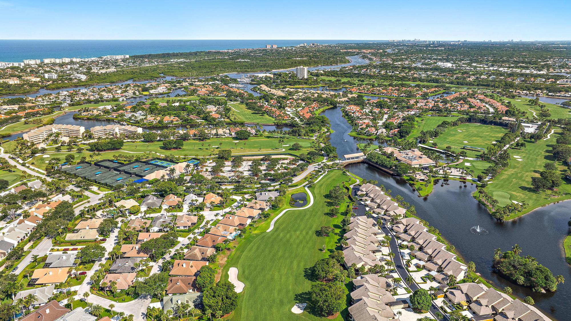 3733 Cape Pointe Circle Jupiter, FL 33477 - Photo 35 of 38 an aerial view of residential houses with outdoor space