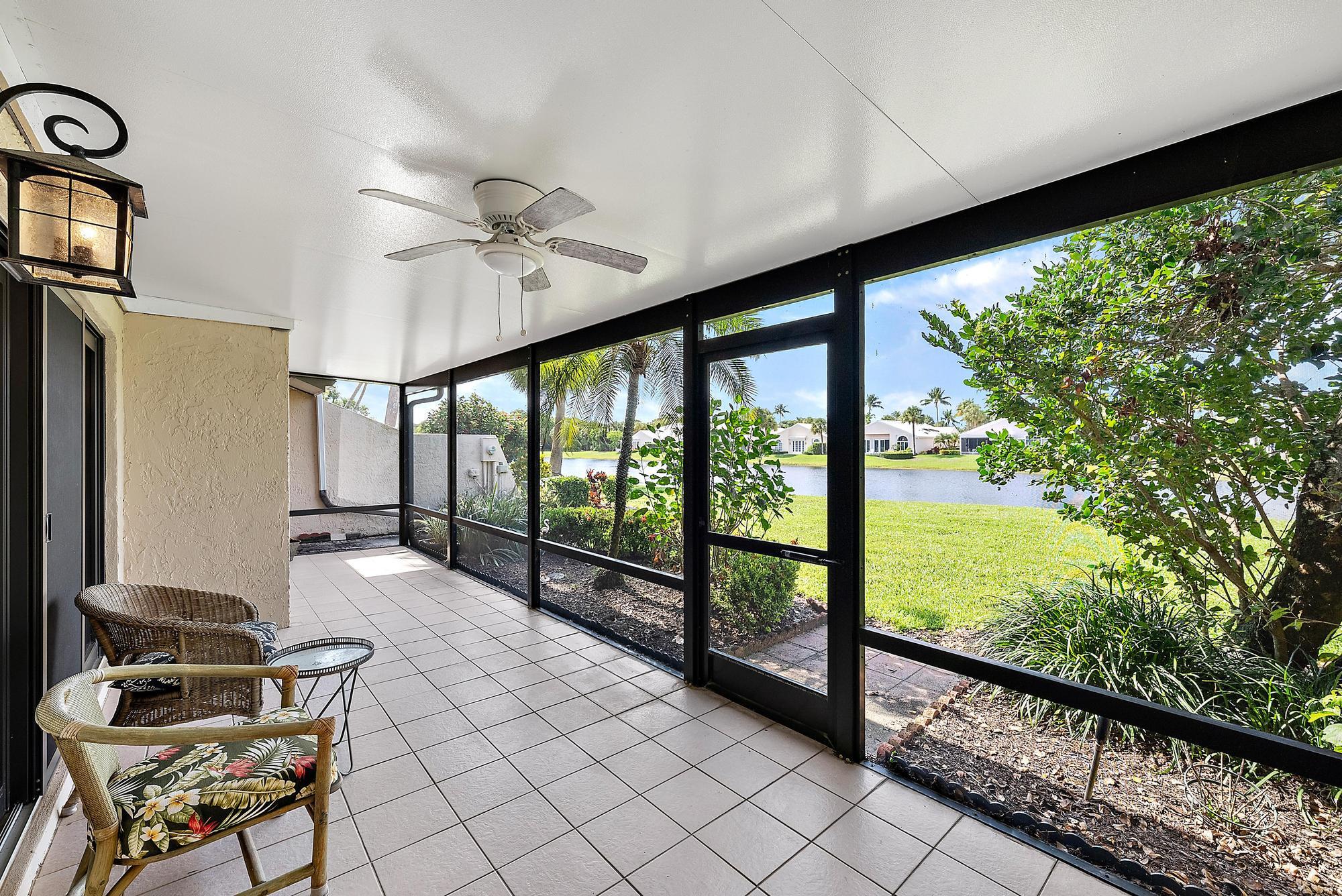3733 Cape Pointe Circle Jupiter, FL 33477 - Photo 10 of 38 a view of a living room and floor to ceiling window