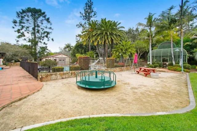 a view of a house with palm trees