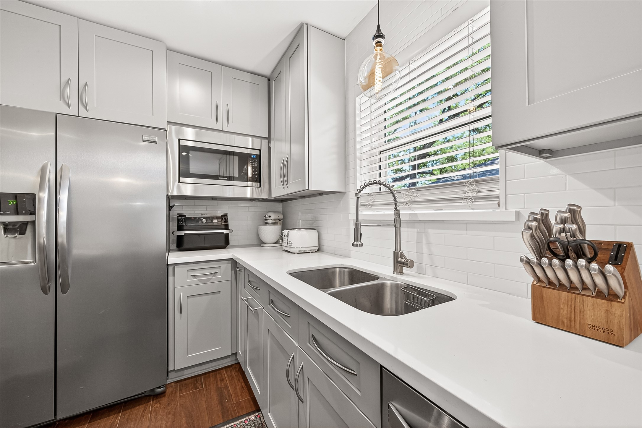2610 Teague Road Houston, TX 77080 - Photo 26 of 49 Well-appointed kitchen featuring abundant cabinetry and storage, stainless steel appliances, and an abundance of natural light that enhances the bright, welcoming atmosphere.