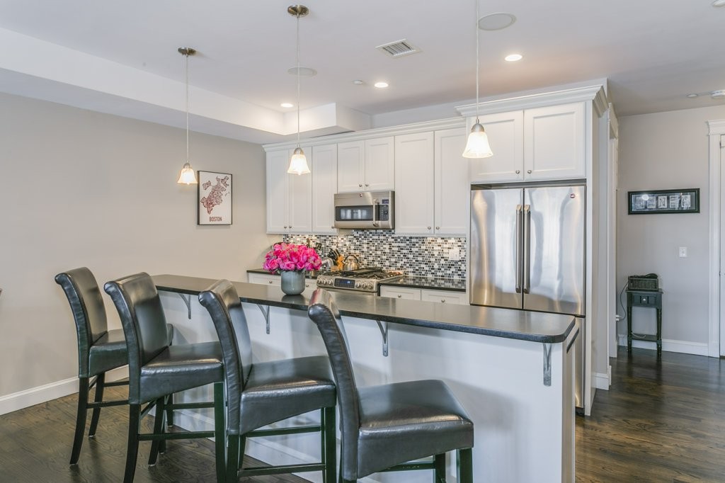 350 West 2nd Street, Unit 2 Boston, MA 02127 - Photo 4 of 12 a view of a dining room with furniture and wooden floor