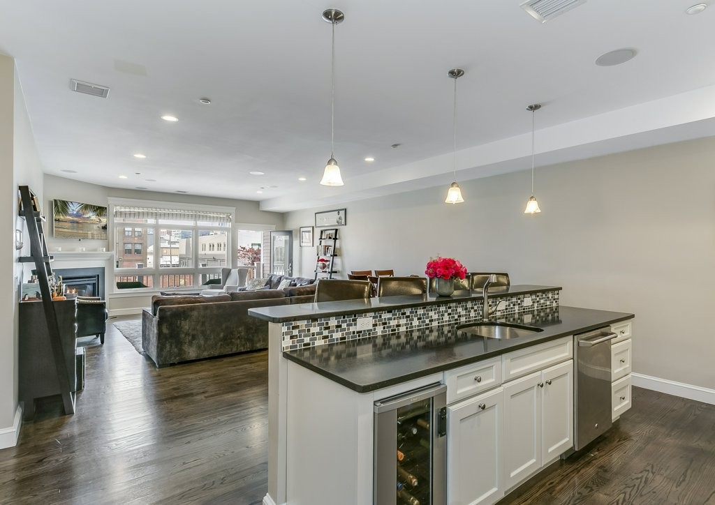 350 West 2nd Street, Unit 2 Boston, MA 02127 - Photo 5 of 12 a kitchen with stainless steel appliances granite countertop a stove and a sink