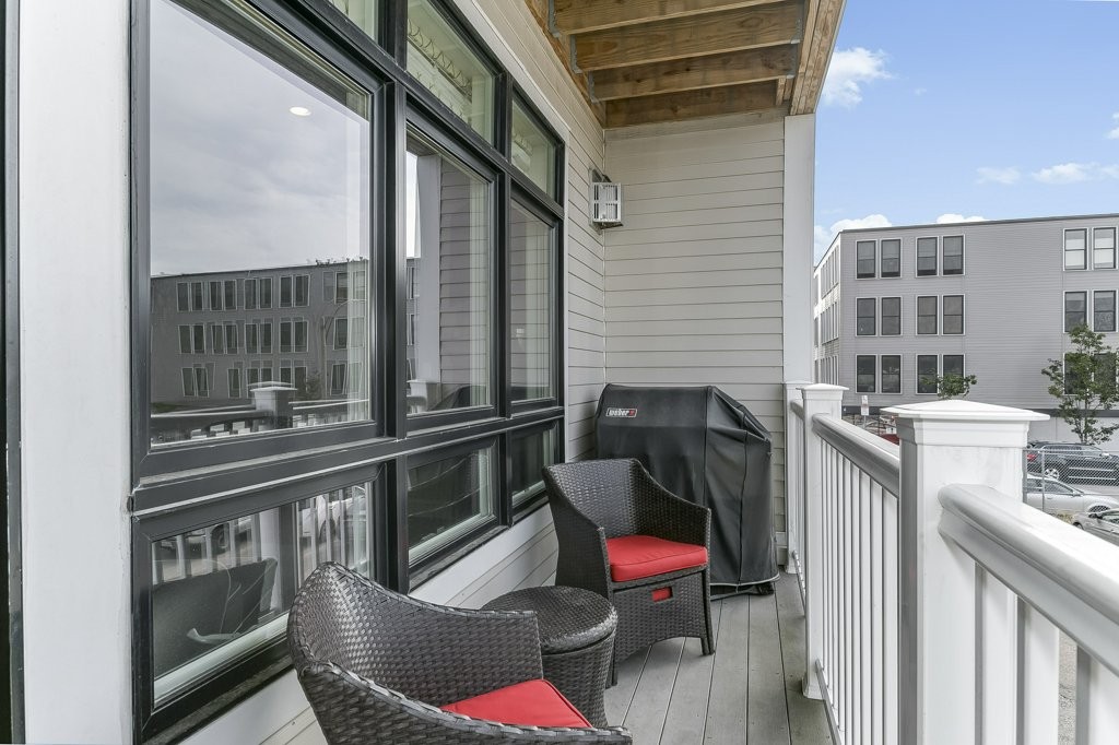 350 West 2nd Street, Unit 2 Boston, MA 02127 - Photo 7 of 12 a view of a chairs and table in the balcony