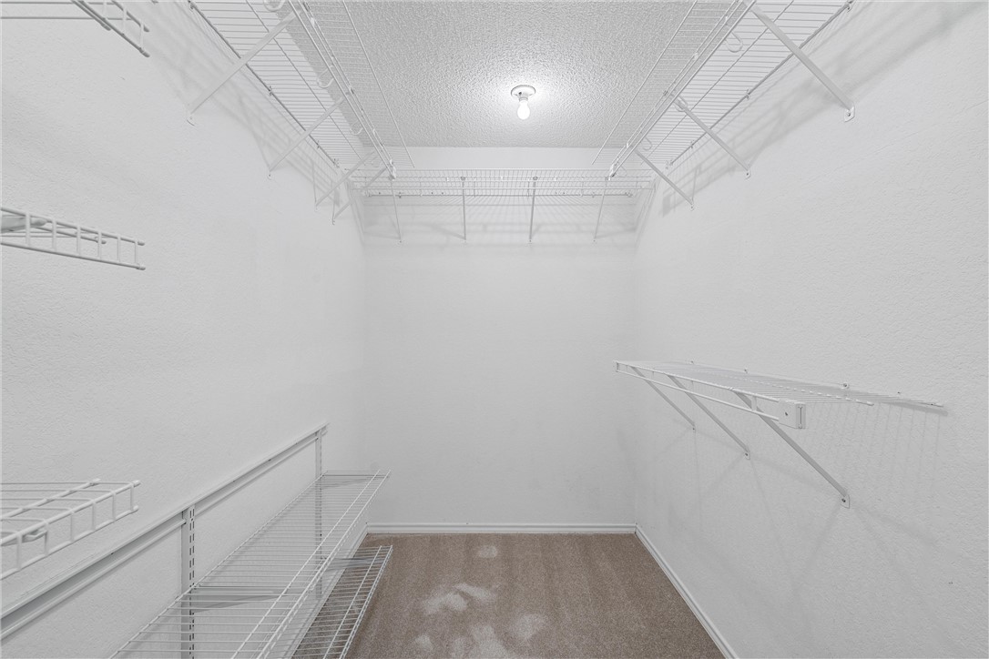 125 Pleasant Grove Lane Waco, TX 76712 - Photo 16 of 25 a view of a room with racks on the wall