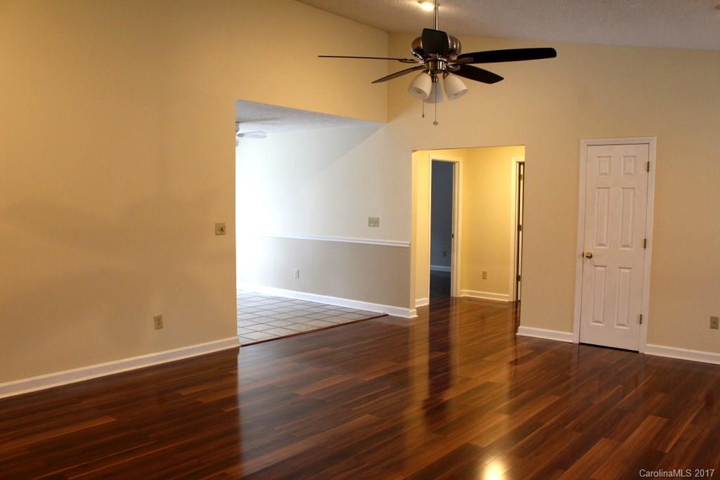 1417 Shiloh Ranch Road Lancaster, SC 29720 - Photo 4 of 23 a view of a livingroom with wooden floor and a ceiling fan