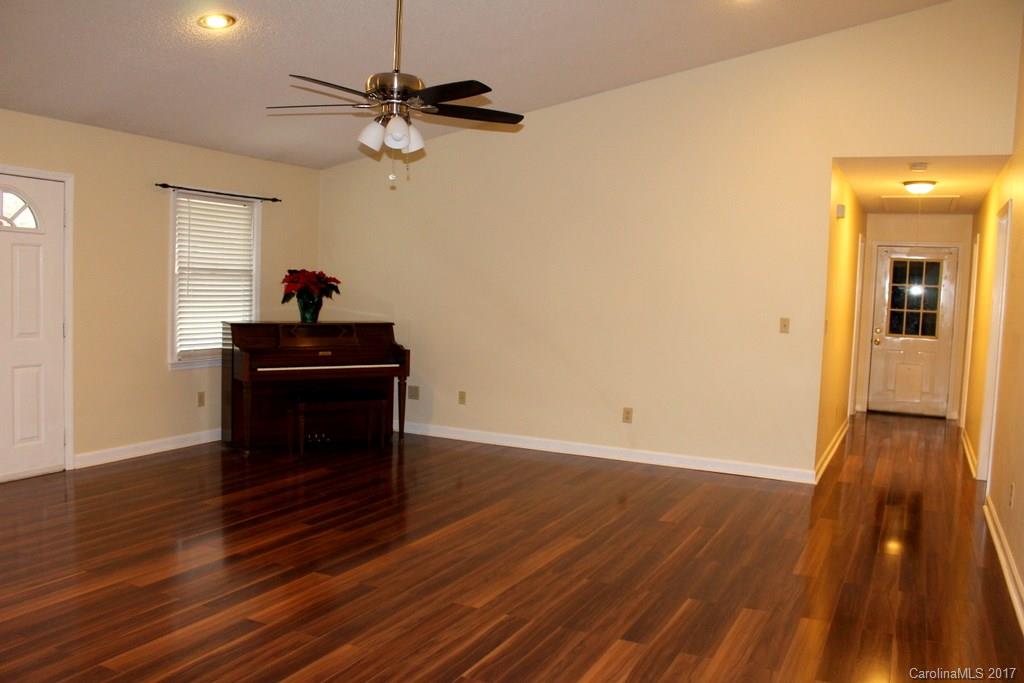 1417 Shiloh Ranch Road Lancaster, SC 29720 - Photo 5 of 23 a view of a livingroom with wooden floor and a ceiling fan
