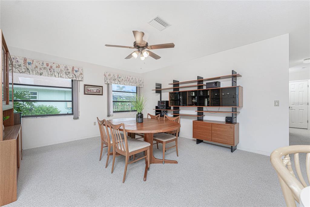 21 Bunker Lane Rotonda West, FL 33947 - Photo 15 of 51 a dining room with furniture and window
