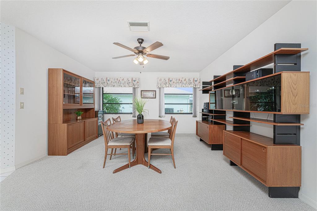 21 Bunker Lane Rotonda West, FL 33947 - Photo 16 of 51 a dining room with furniture and window