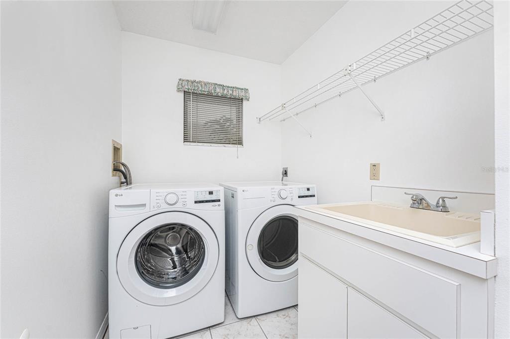 21 Bunker Lane Rotonda West, FL 33947 - Photo 21 of 51 a utility room with dryer and washer