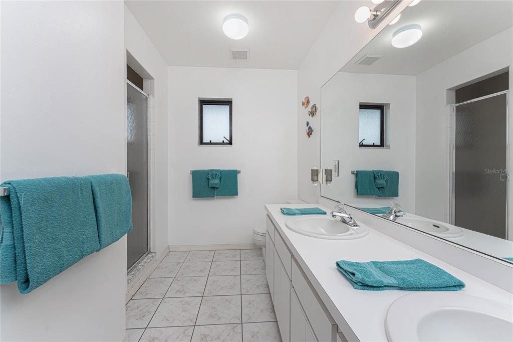 21 Bunker Lane Rotonda West, FL 33947 - Photo 25 of 51 a bathroom with a tub sink and mirror