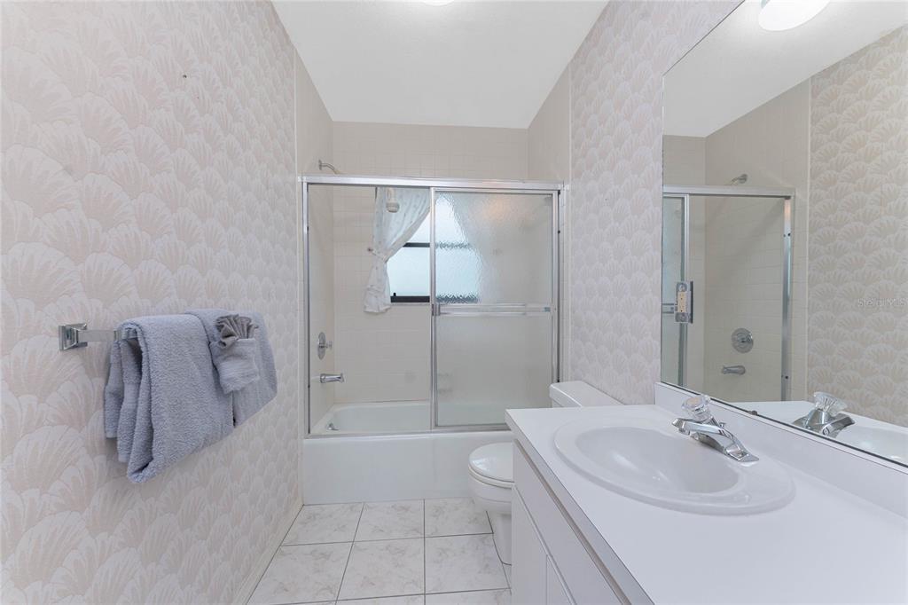 21 Bunker Lane Rotonda West, FL 33947 - Photo 36 of 51 a bathroom with a sink a toilet and shower