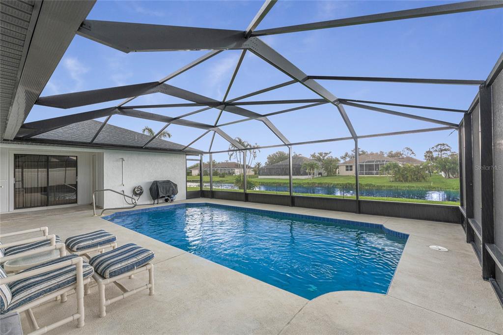 21 Bunker Lane Rotonda West, FL 33947 - Photo 42 of 51 a room with wooden floor table and chairs