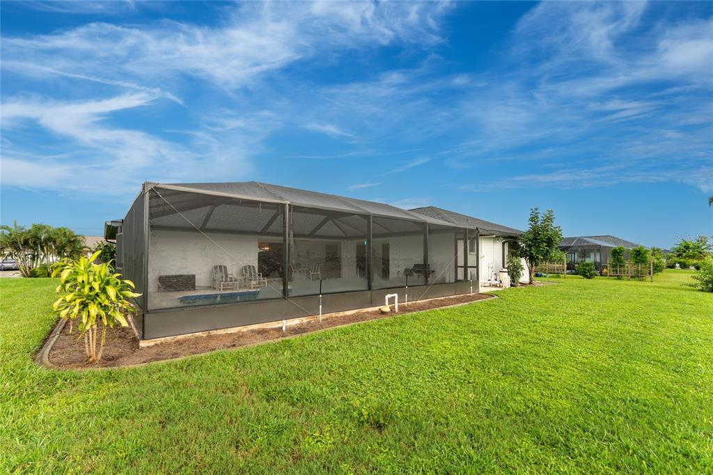 21 Bunker Lane Rotonda West, FL 33947 - Photo 47 of 51 a house view with a garden space