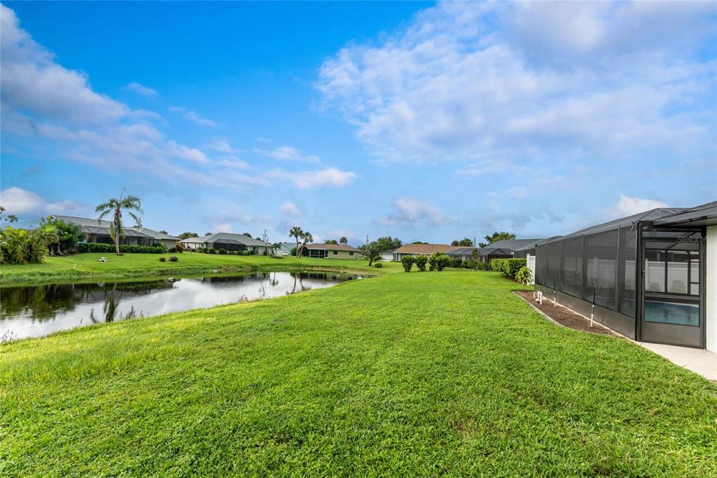 21 Bunker Lane Rotonda West, FL 33947 - Photo 49 of 51 a view of a lake with houses