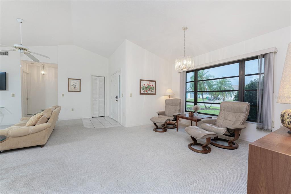 21 Bunker Lane Rotonda West, FL 33947 - Photo 5 of 51 a living room with furniture and a window