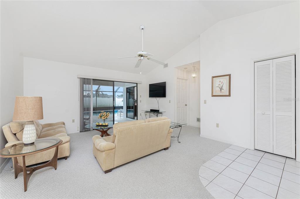 21 Bunker Lane Rotonda West, FL 33947 - Photo 7 of 51 a living room with furniture and a flat screen tv