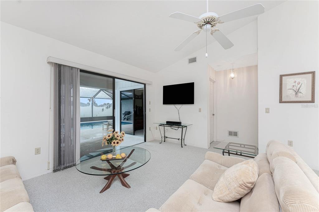 21 Bunker Lane Rotonda West, FL 33947 - Photo 9 of 51 a living room with furniture and a flat screen tv