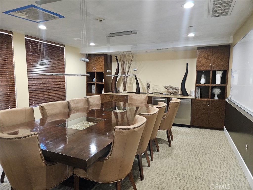 100 South Alameda Street, Unit 348 Los Angeles, CA 90012 - Photo 14 of 15 a view of a dining room with furniture