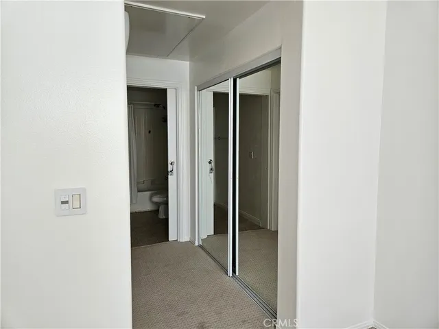 a view of a hallway with closet