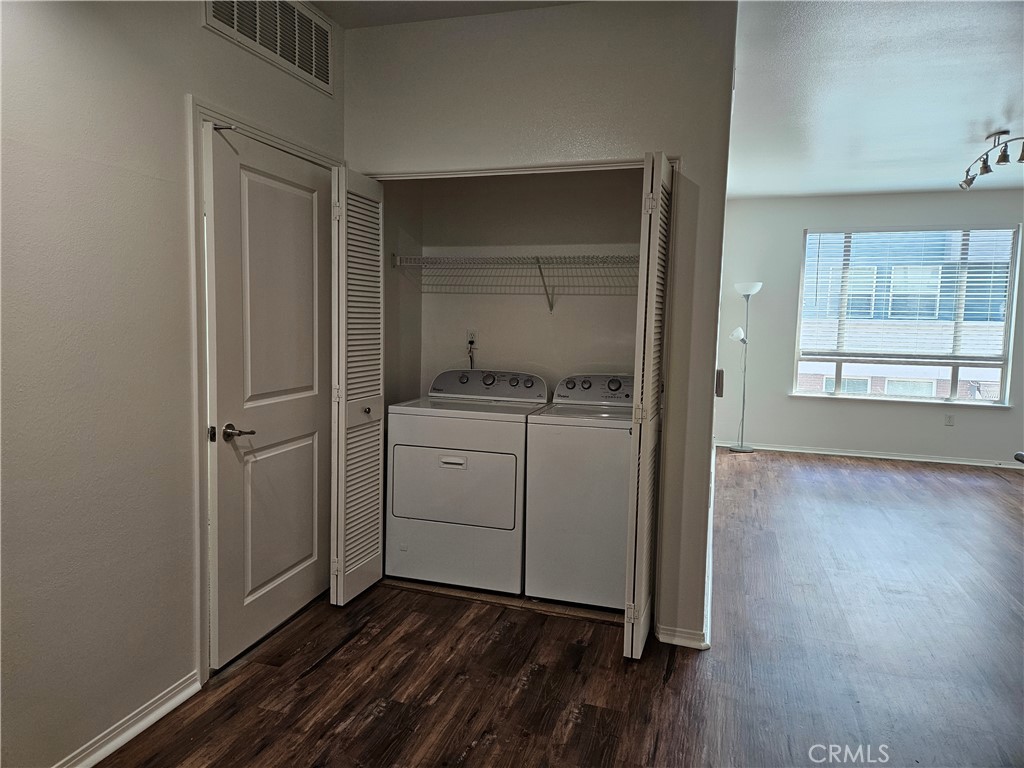 100 South Alameda Street, Unit 348 Los Angeles, CA 90012 - Photo 10 of 15 a view of a storage & utility room with closet wooden floor