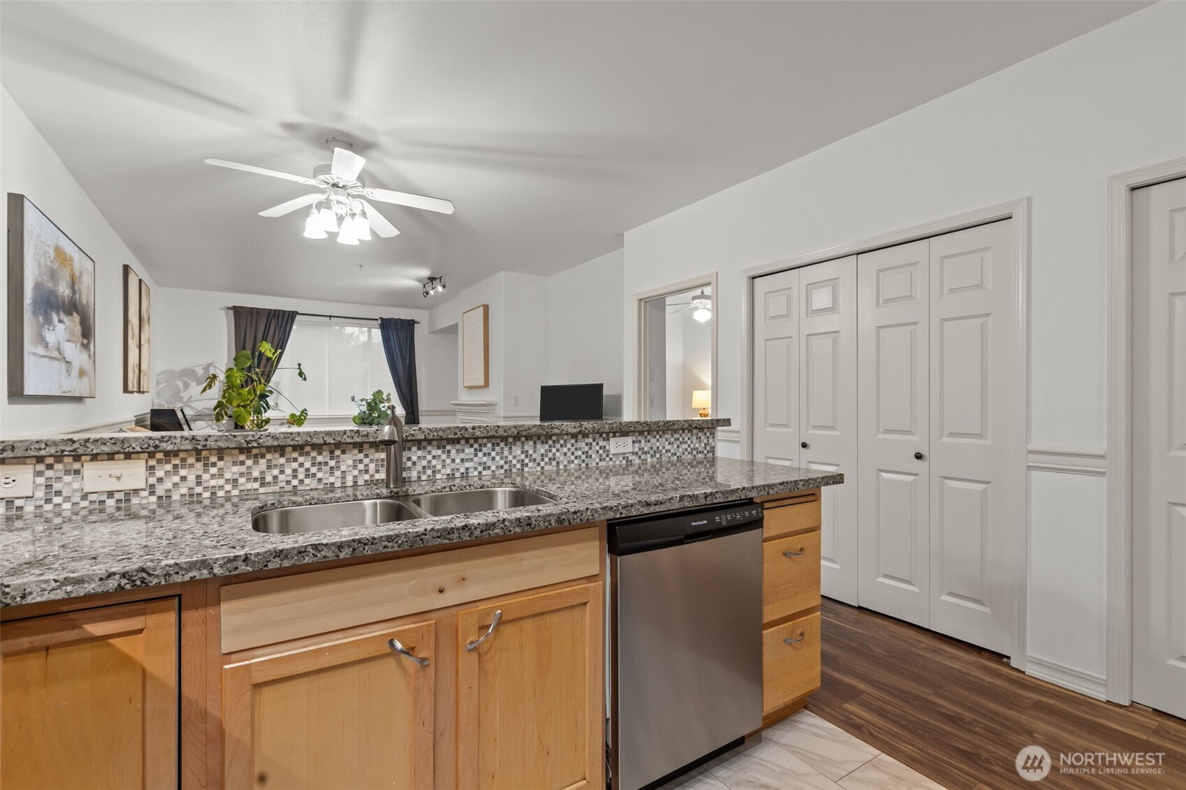 440 Maple Avenue Southwest, Unit A106 Renton, WA 98057 - Photo 16 of 39 a bathroom with a granite countertop sink a mirror and a shower