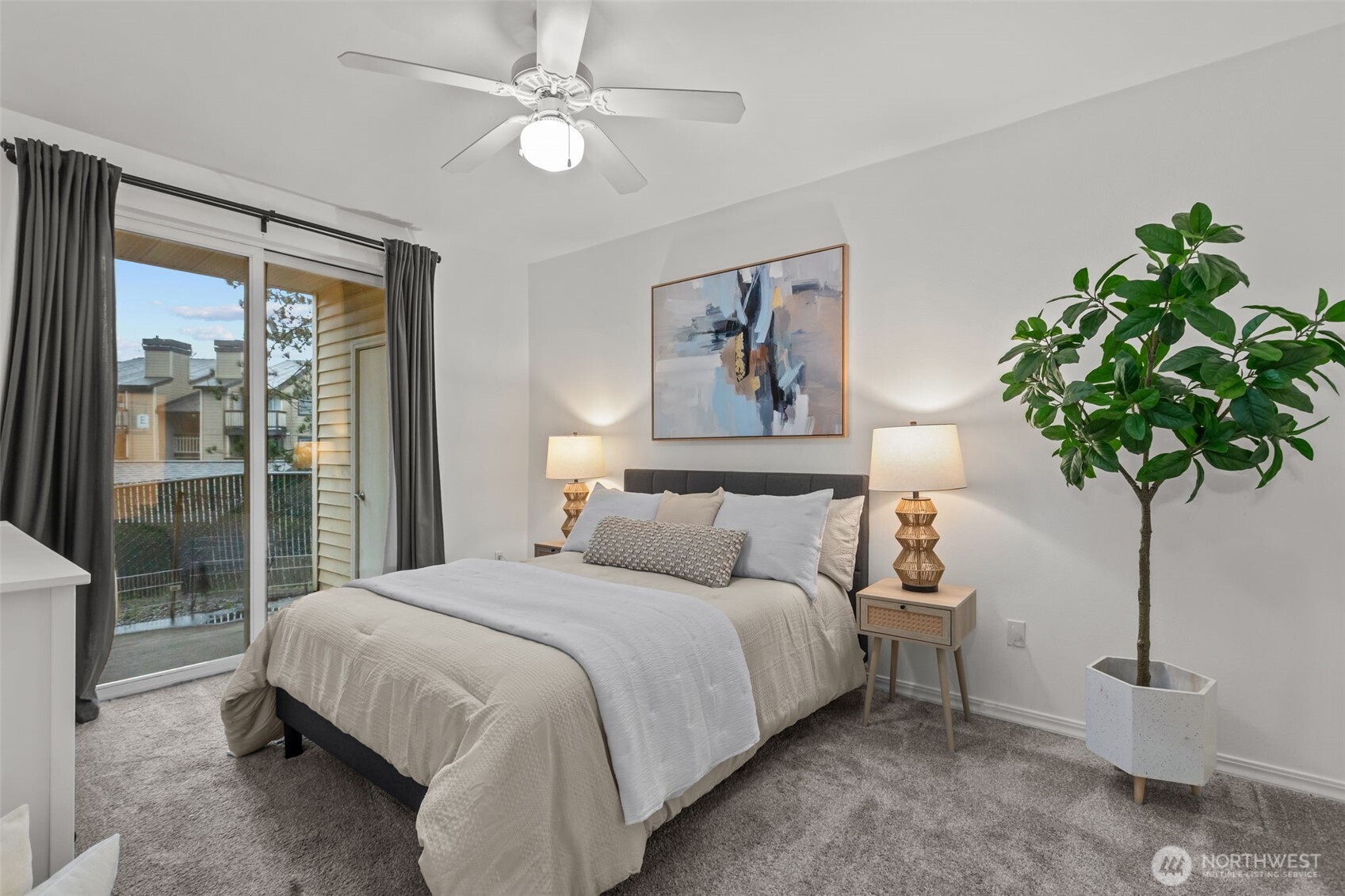 440 Maple Avenue Southwest, Unit A106 Renton, WA 98057 - Photo 18 of 39 a bedroom with bed and a potted plant