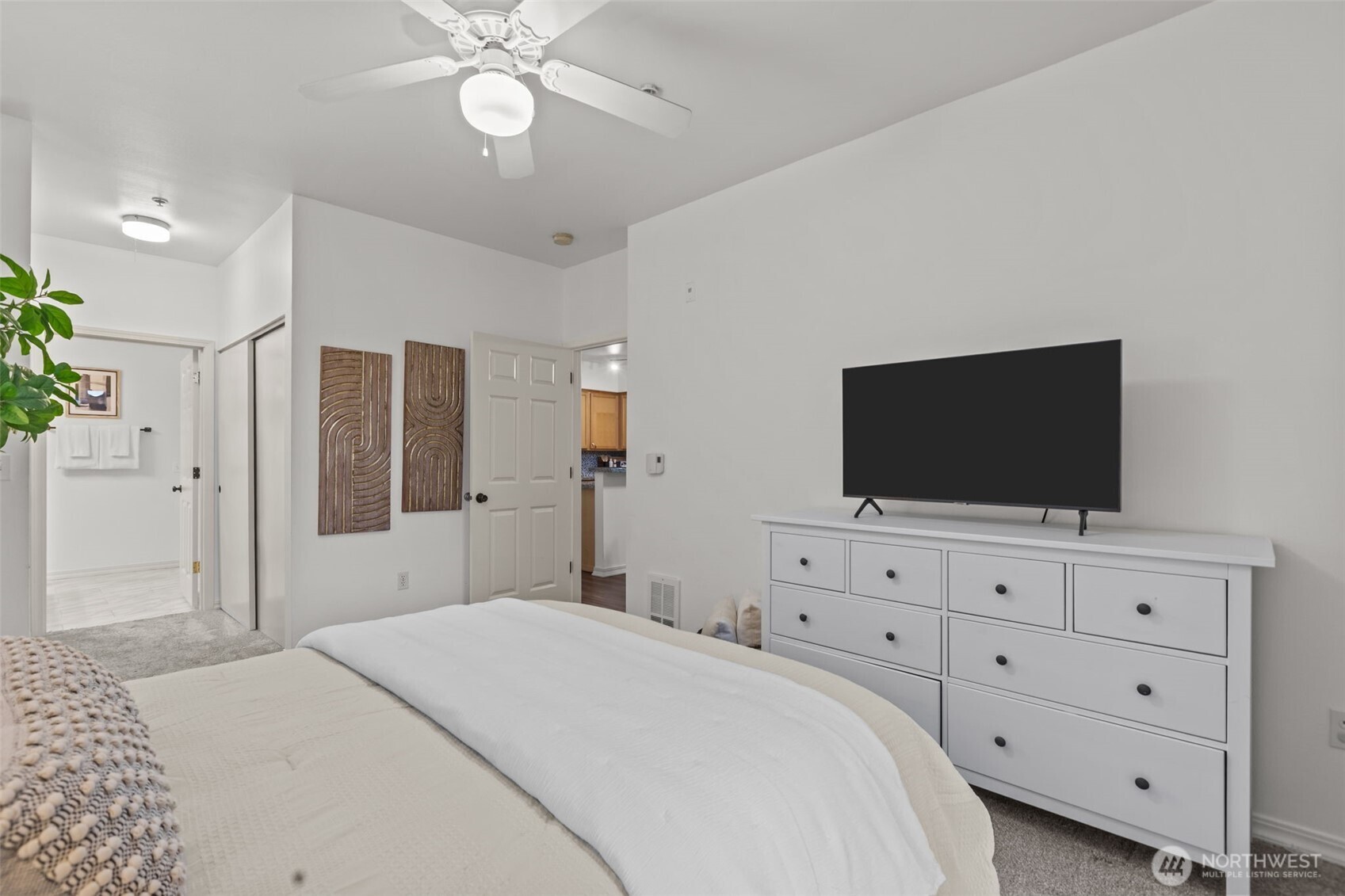 440 Maple Avenue Southwest, Unit A106 Renton, WA 98057 - Photo 19 of 39 a bedroom with a bed and a flat screen tv