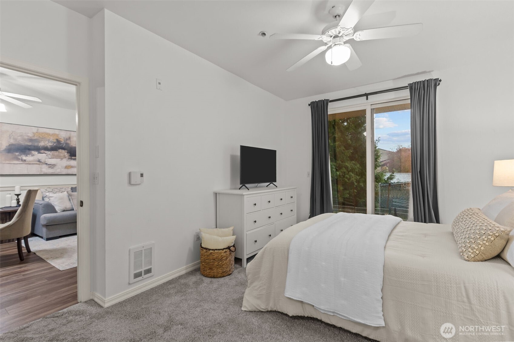 440 Maple Avenue Southwest, Unit A106 Renton, WA 98057 - Photo 21 of 39 a bedroom with a bed and a flat screen tv