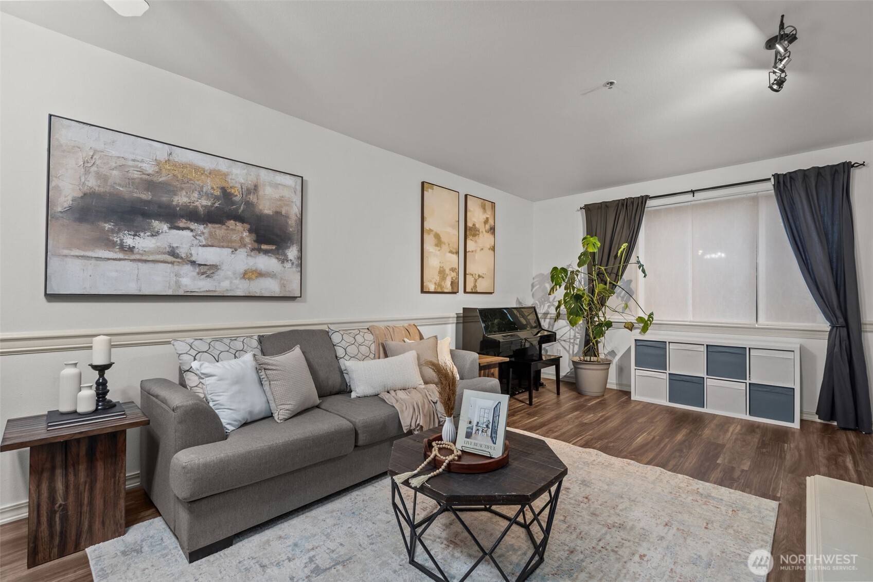 440 Maple Avenue Southwest, Unit A106 Renton, WA 98057 - Photo 4 of 39 a living room with furniture a wooden floor and a fireplace