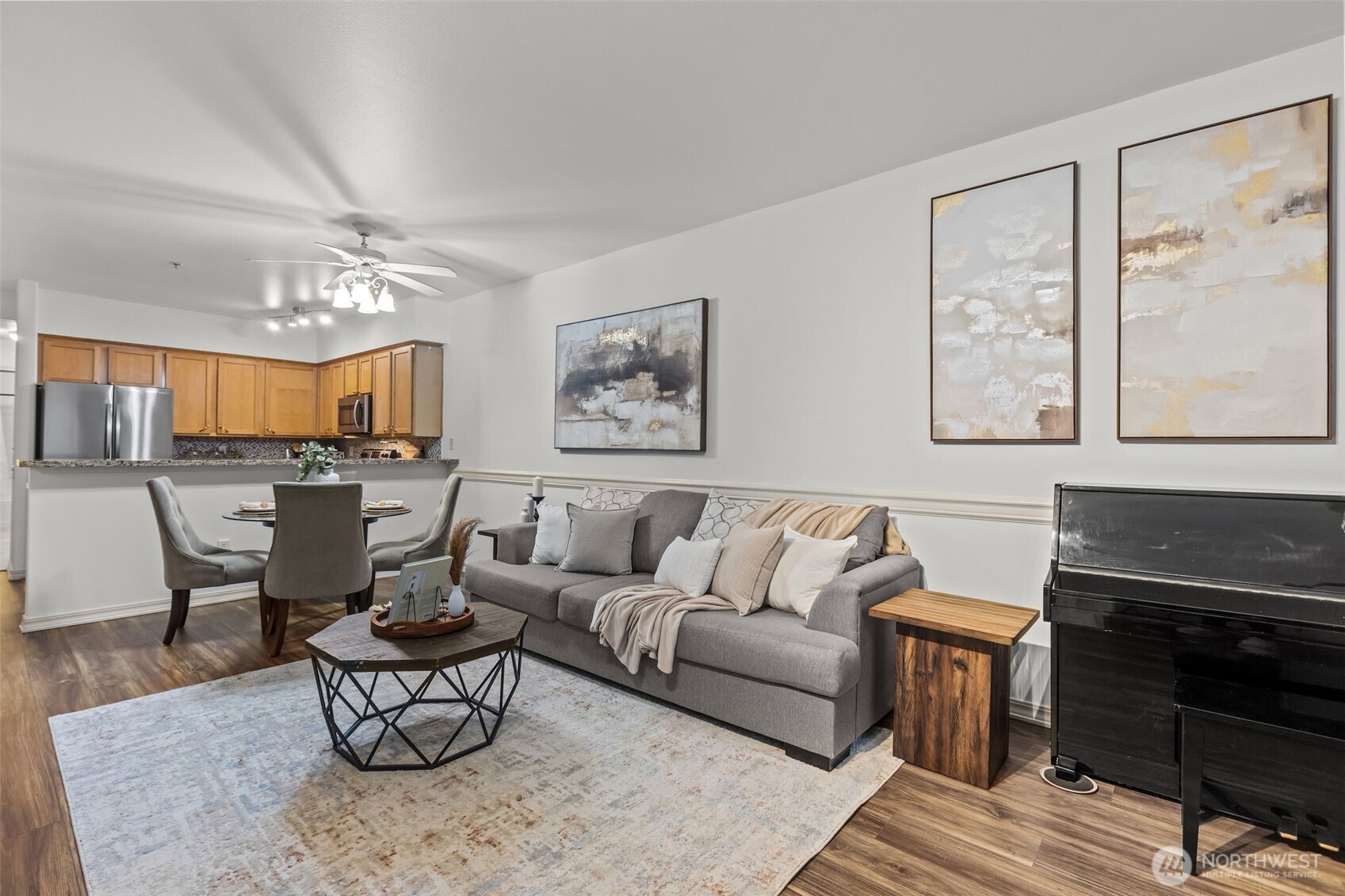 440 Maple Avenue Southwest, Unit A106 Renton, WA 98057 - Photo 7 of 39 a living room with furniture a fireplace and a large window
