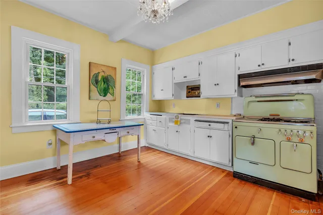 a kitchen with wooden cabinets and center island