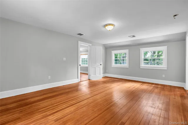 a bathroom with a sink a bathtub and a window
