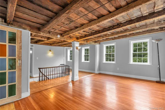 a view of entryway with wooden floor