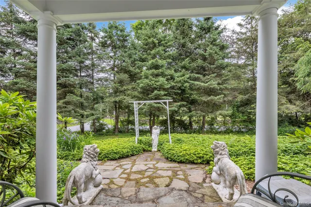 swimming pool view with a seating space