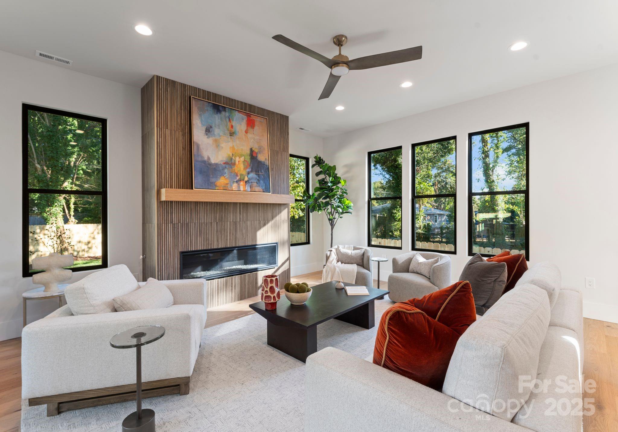 4641 Connecting Road Charlotte, NC 28209 - Photo 13 of 48 a living room with furniture large window and fireplace