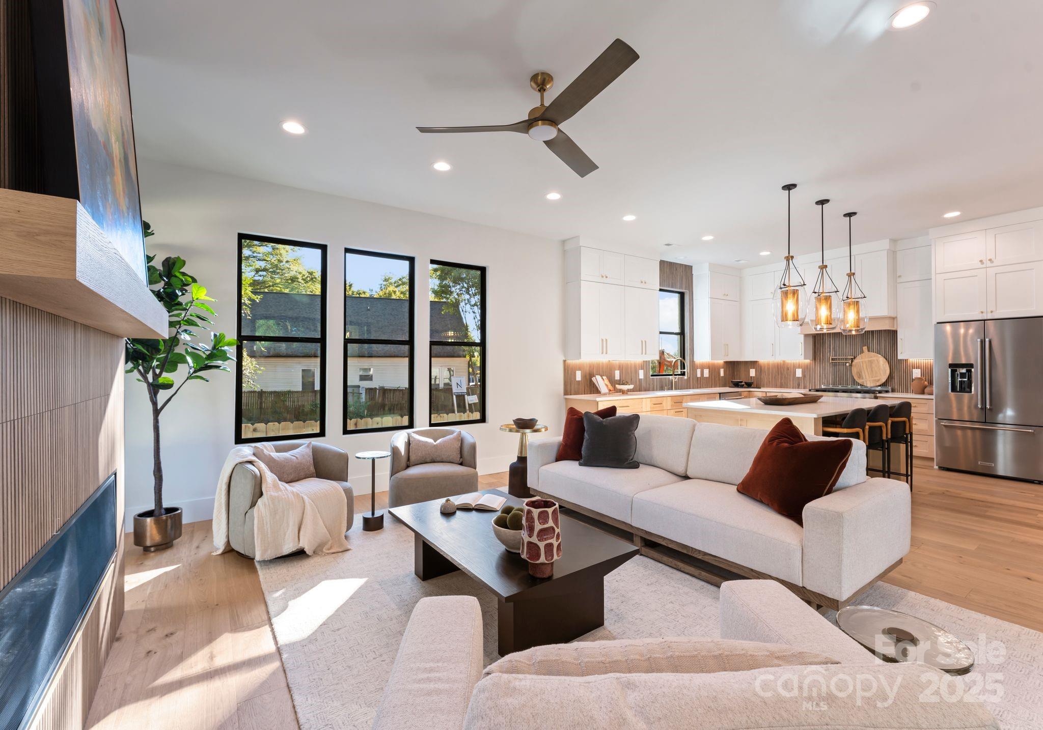 4641 Connecting Road Charlotte, NC 28209 - Photo 16 of 48 a living room with furniture and a large window