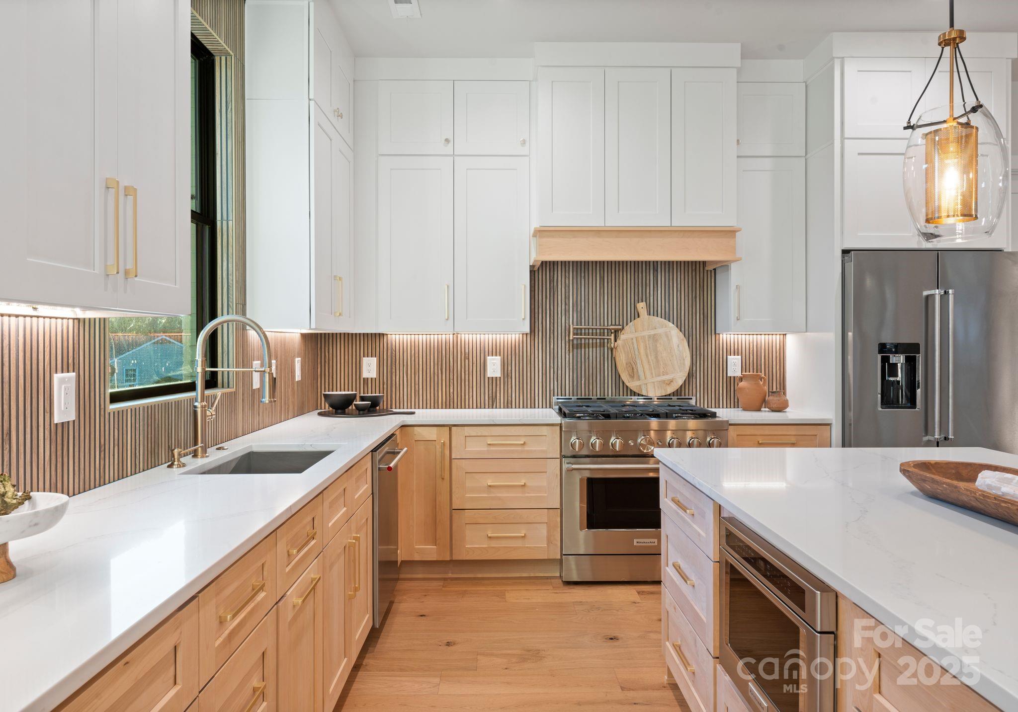 4641 Connecting Road Charlotte, NC 28209 - Photo 20 of 48 a kitchen with stainless steel appliances granite countertop a sink stove and refrigerator