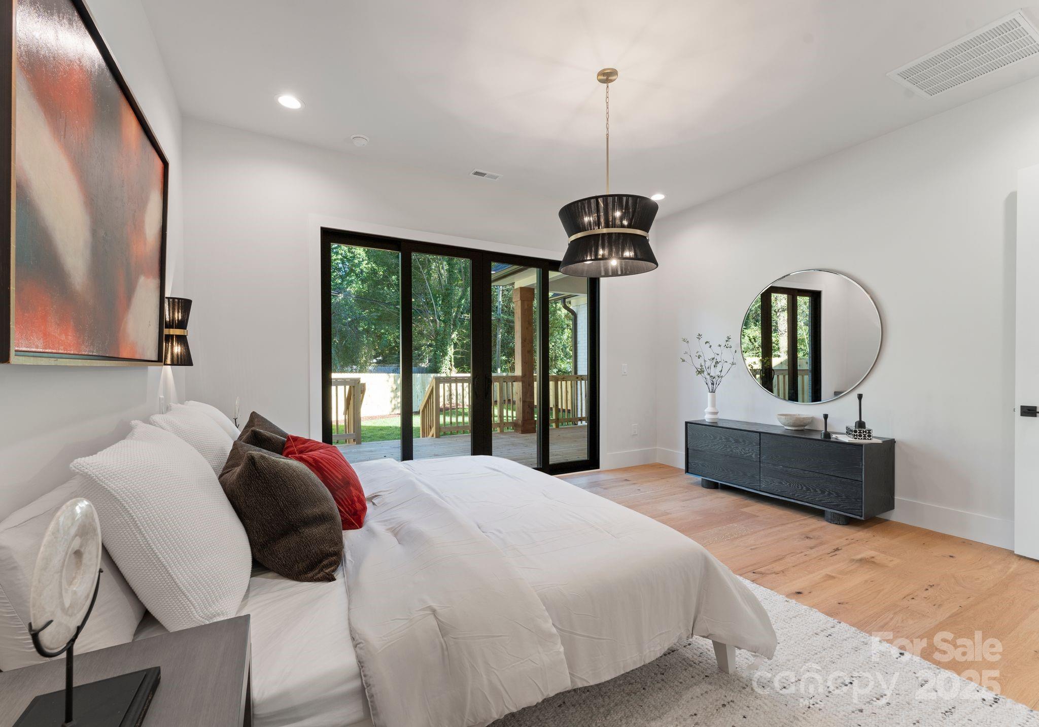 4641 Connecting Road Charlotte, NC 28209 - Photo 25 of 48 a bedroom with a bed mirror and window