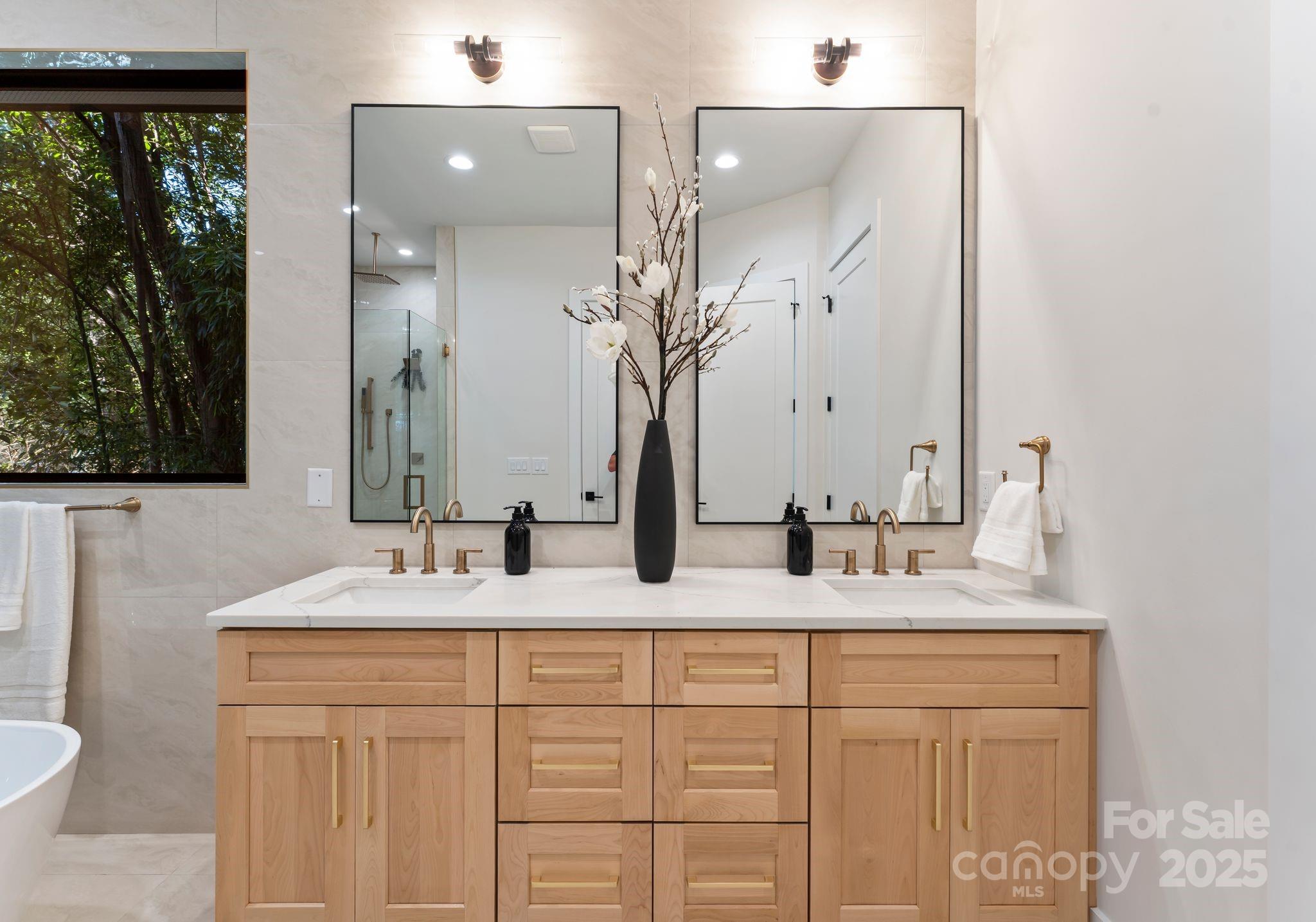 4641 Connecting Road Charlotte, NC 28209 - Photo 27 of 48 a bathroom with a double vanity sink and a mirror