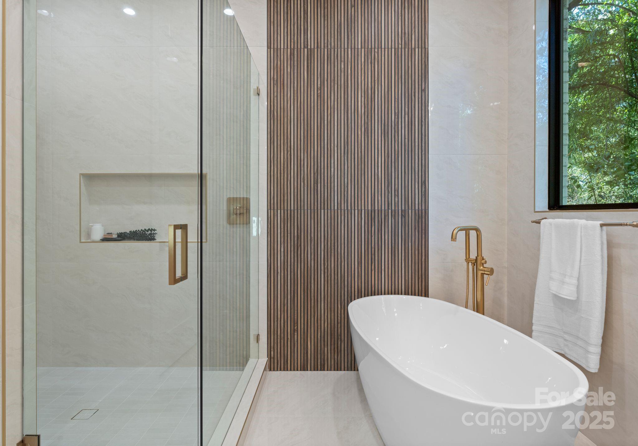 4641 Connecting Road Charlotte, NC 28209 - Photo 28 of 48 a bathroom with a white bath tub a shower and a sink