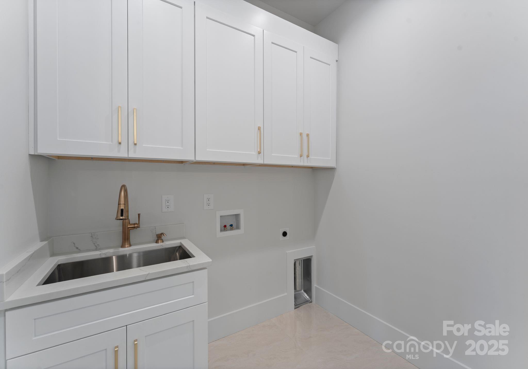 4641 Connecting Road Charlotte, NC 28209 - Photo 31 of 48 a kitchen with a sink and cabinets