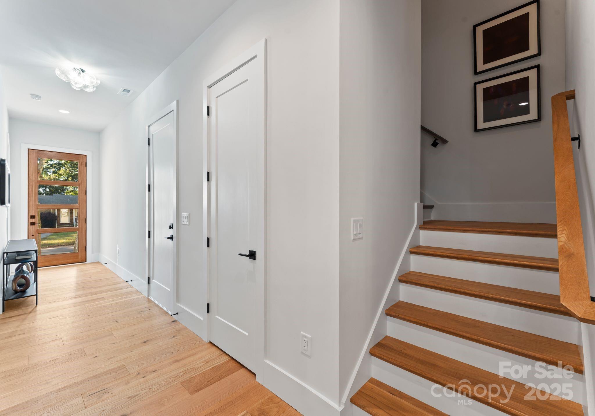 4641 Connecting Road Charlotte, NC 28209 - Photo 34 of 48 a view of a hallway with wooden floor and windows