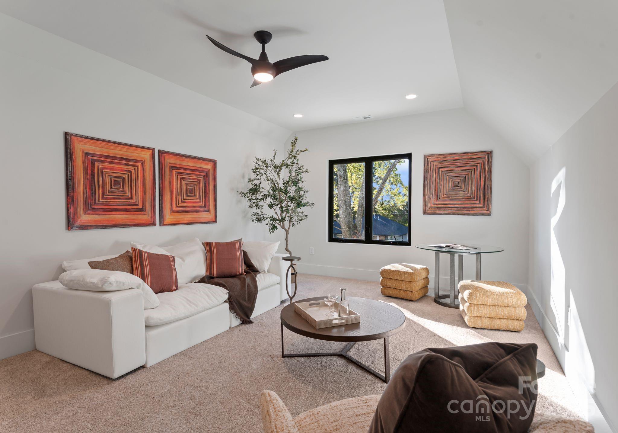 4641 Connecting Road Charlotte, NC 28209 - Photo 36 of 48 a living room with furniture and a rug