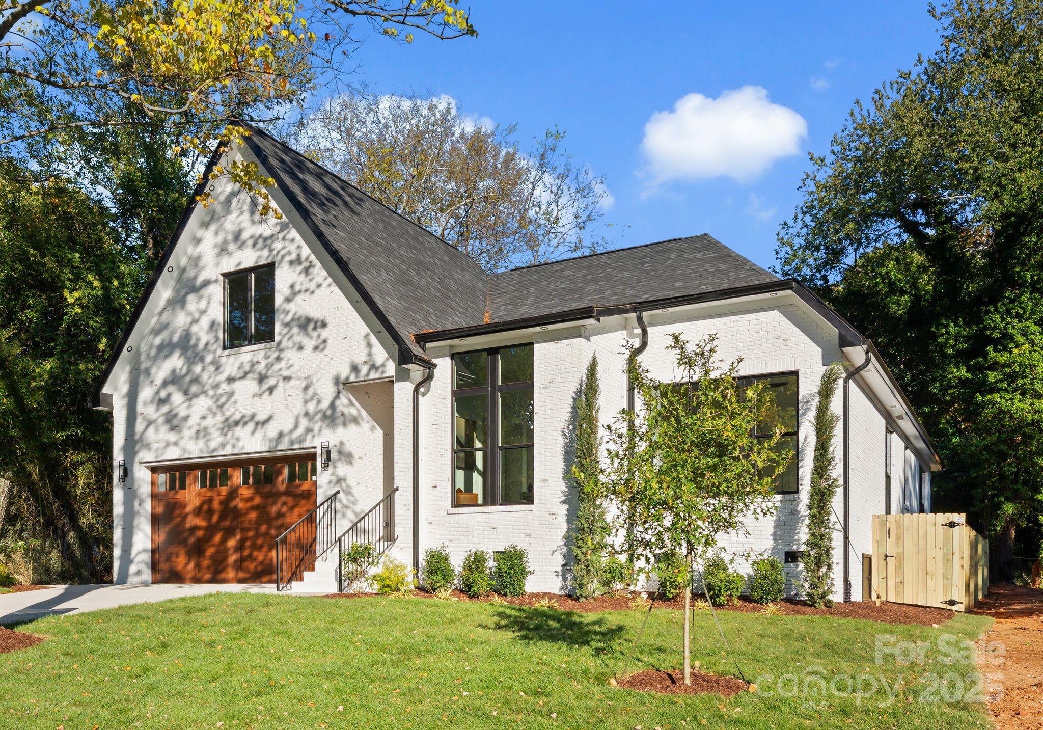 4641 Connecting Road Charlotte, NC 28209 - Photo 38 of 48 a front view of a house with garden